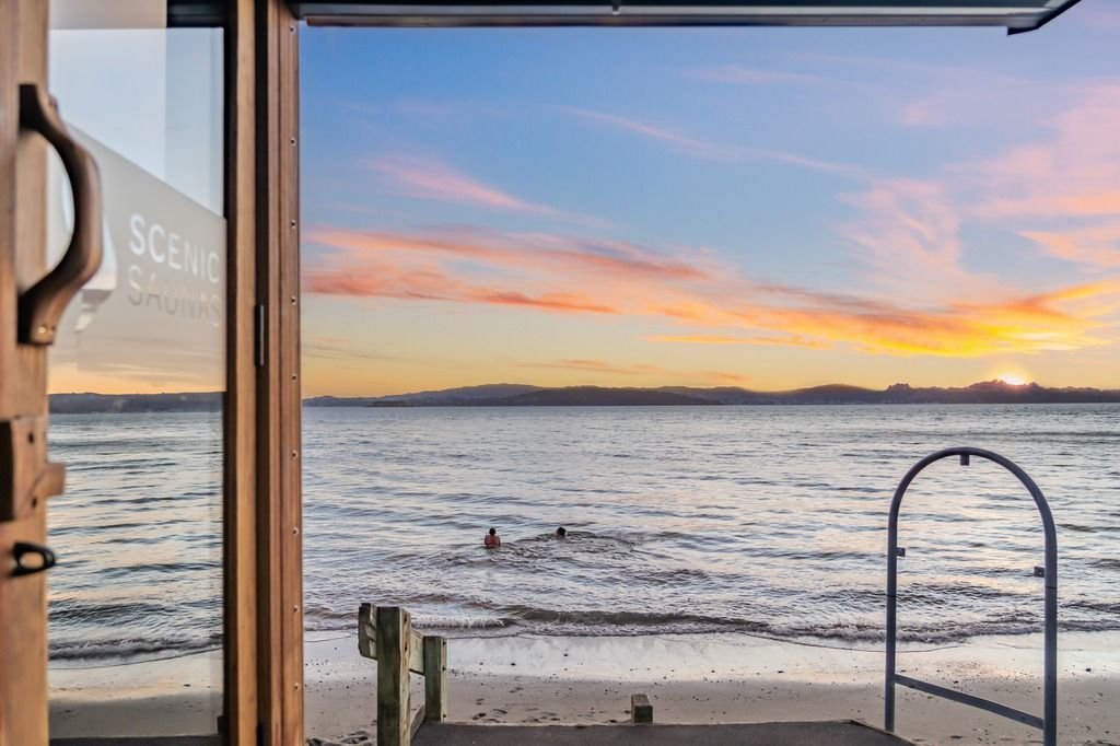 View from sauna door to ocean sunset, science-backed benefits of sauna for sports