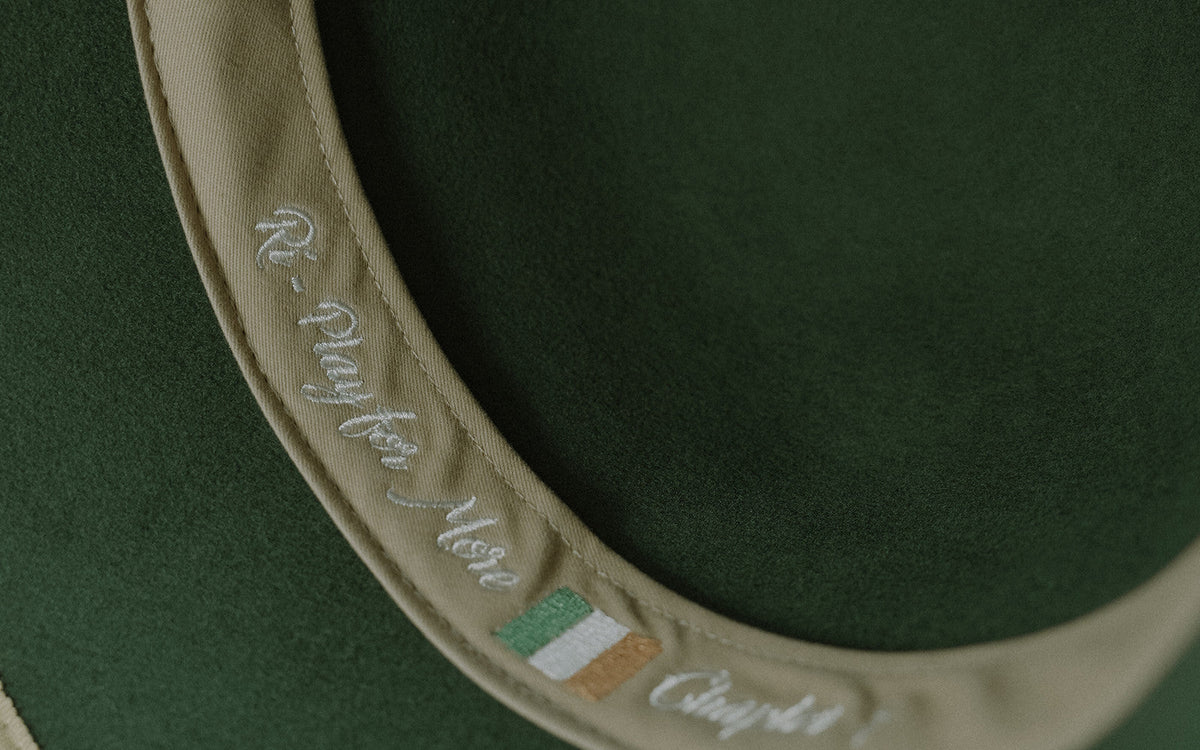 Inside band of the Rí Sauna Crown with the Play for More embroidery, the purpose of a sauna hat